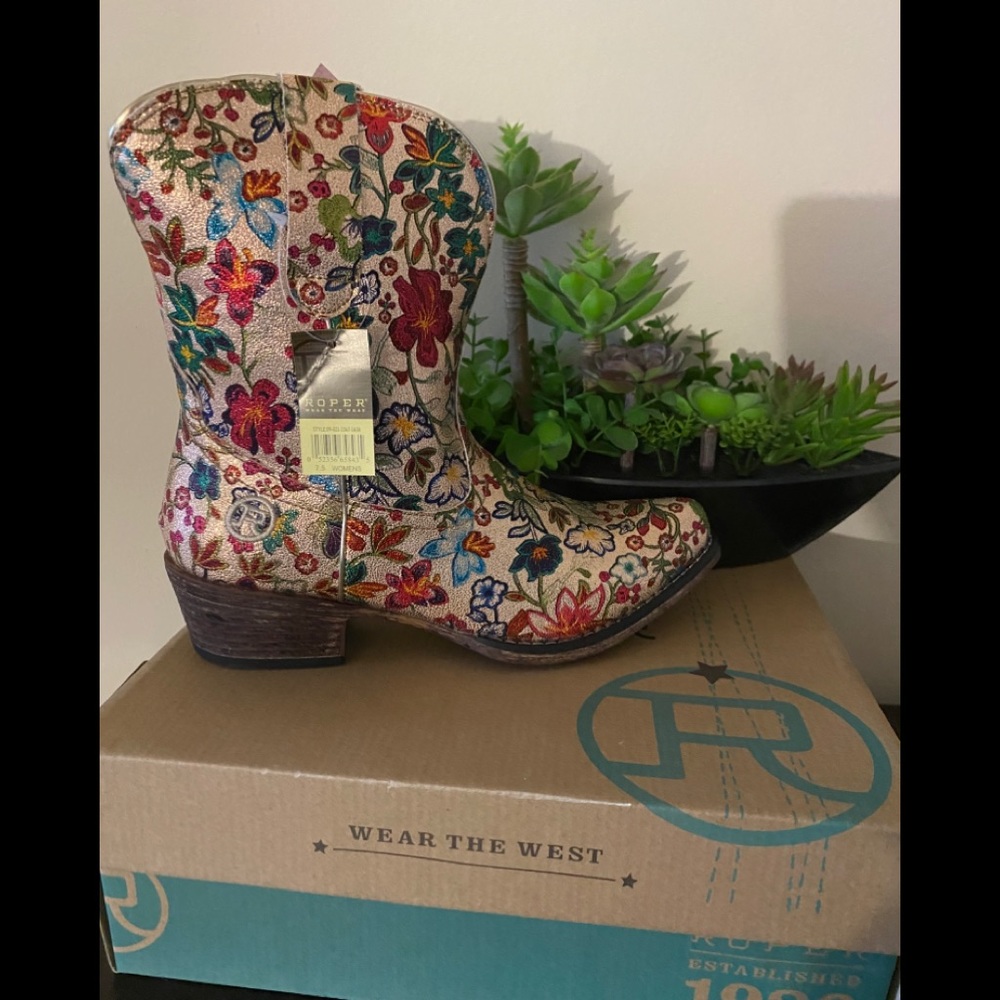 Cowgirl boots still in the box with the tags